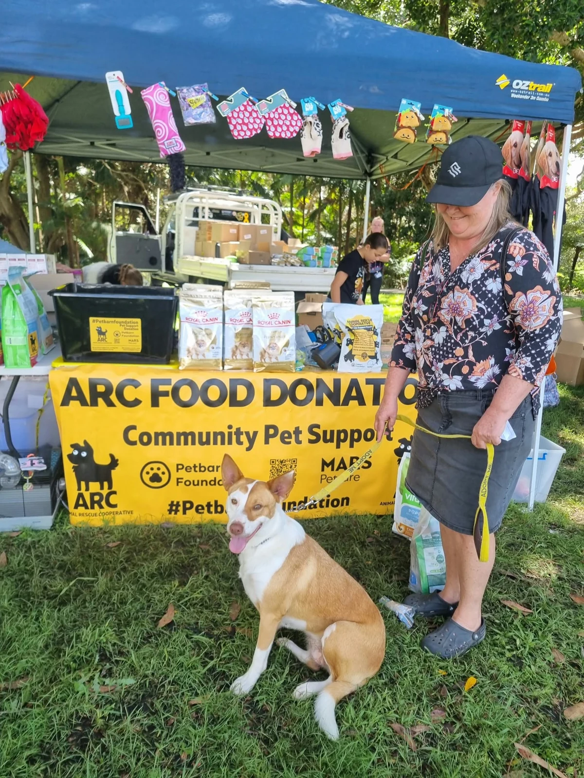 Kempsey community pet support stall with a dog and volunteer