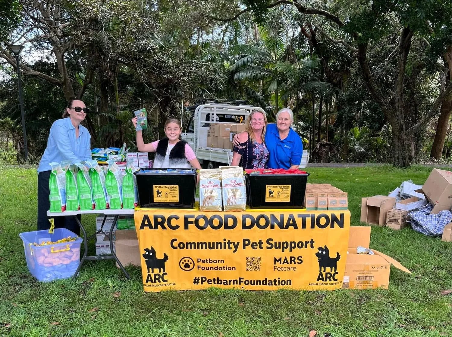 The Kempsey team with donated supplies and an ARC banner